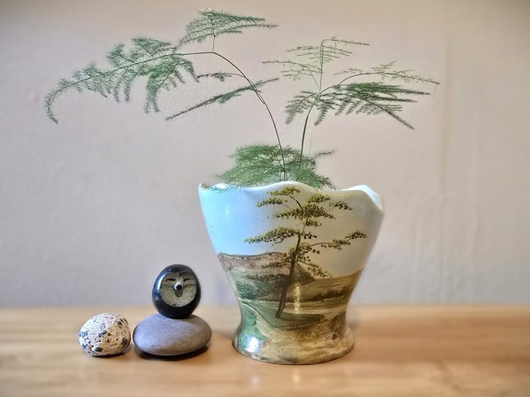 Exmoor pottery eggshell vase with landscape decoration